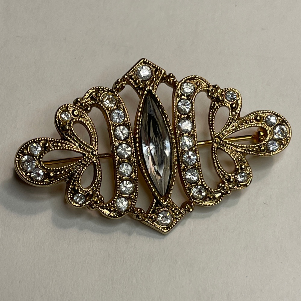 Vintage rhinestone brooch gold tone ornate